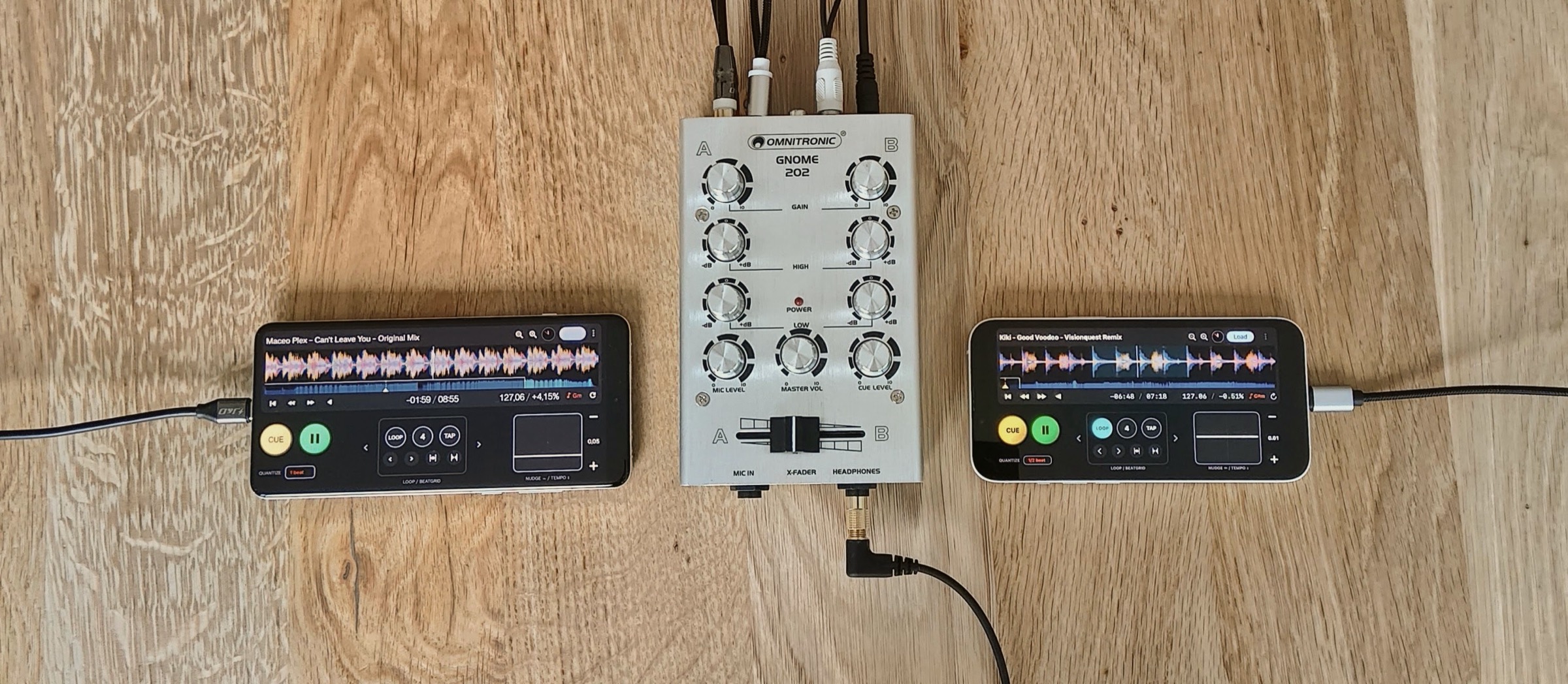 Two phones running Deck connected to a compact mixer